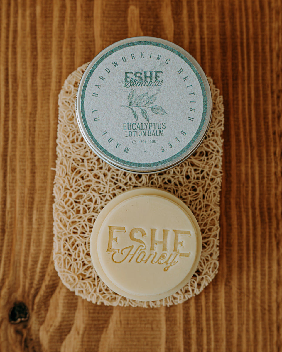 Eucalyptus lotion balm with 'ESHE Honey' branding on a wooden surface