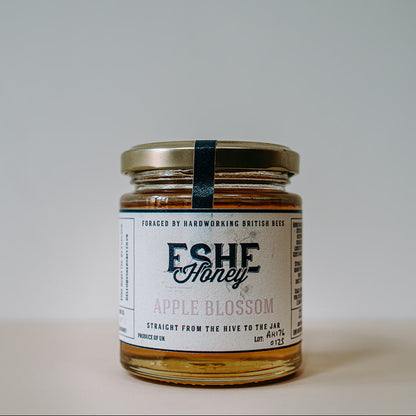 Jar of Eshe Honey Apple Blossom on a plain background