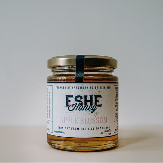 Jar of Eshe Honey Apple Blossom on a plain background