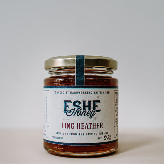 Jar of Eshe Ling Heather honey on a plain background